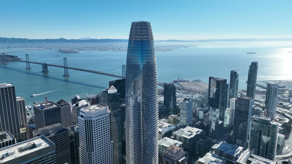 Salesforce Tower centered above downtown San Francisco, with the Bay in the background